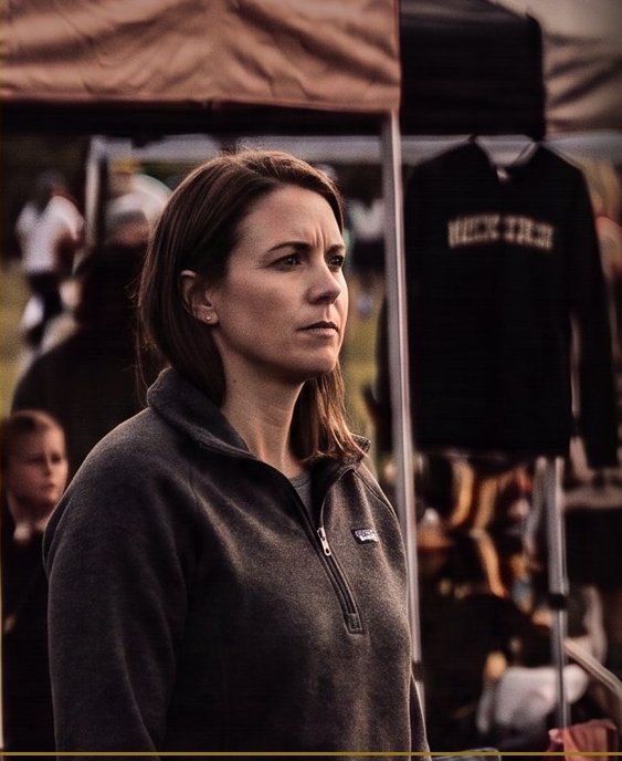 A mother watching a youth tournament